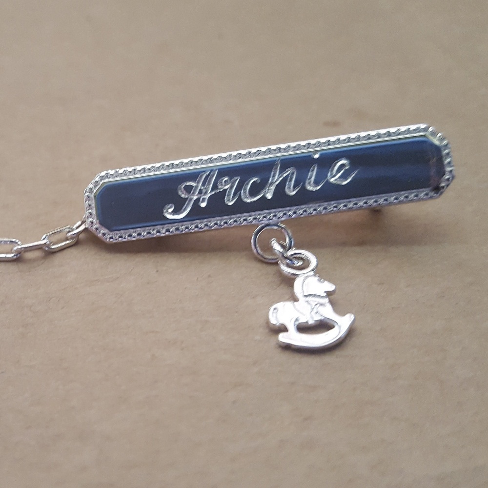 engraved baby brooch with charm
