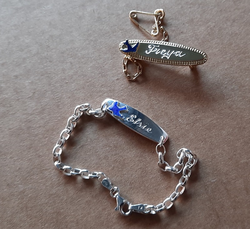 bluebird baby brooch and ID bracelet